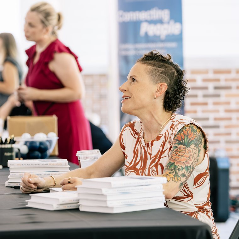 Sarah Matt signing copies of The Borderless Healthcare Revolution after the keynote