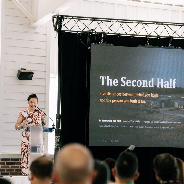 The Second Half keynote title slide on the main screen at the Plug and Play Warsaw Medtech Expo